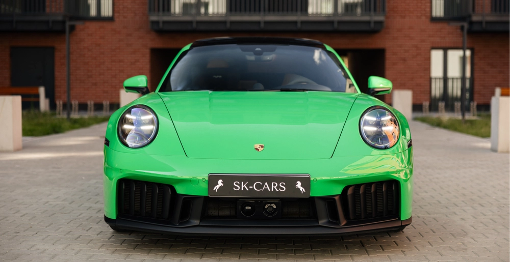 Porsche 911 Carrera GTS in Python Green available for sports car rental in Warsaw