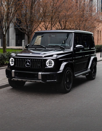 Mercedes G63 AMG LIFT — front view of black premium SUV parked in Warsaw city