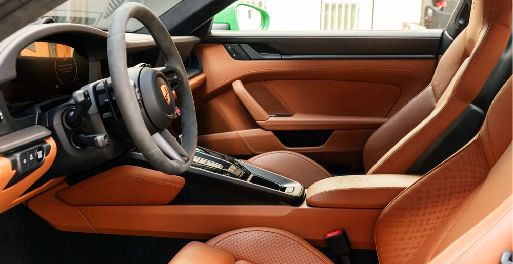 Porsche 911 Carrera GTS premium leather interior available for sports car rental in Warsaw