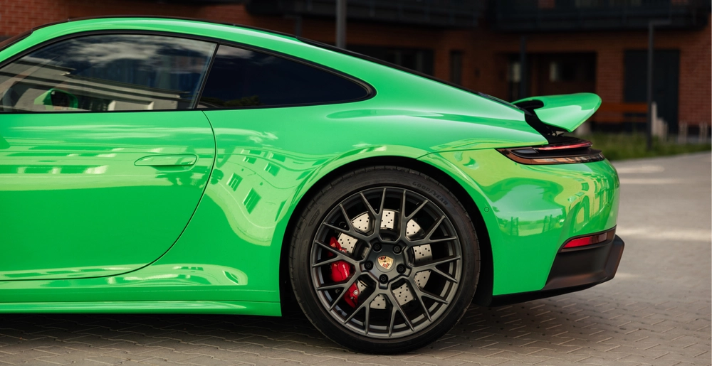 Rear side of Porsche 911 Carrera GTS with active rear spoiler